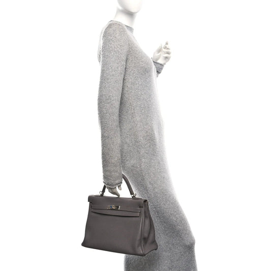 Togo Kelly Retourne 32 Etain