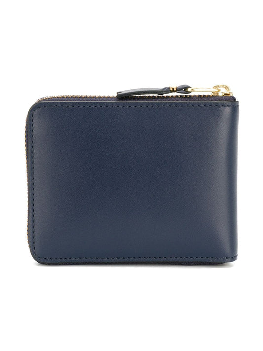 NAVY LEATHER ZIPPED WALLET.